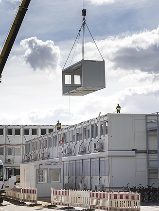 Picture of a construction container landscape with a mobile crane